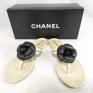 Chanel Camellia black and white flip flops